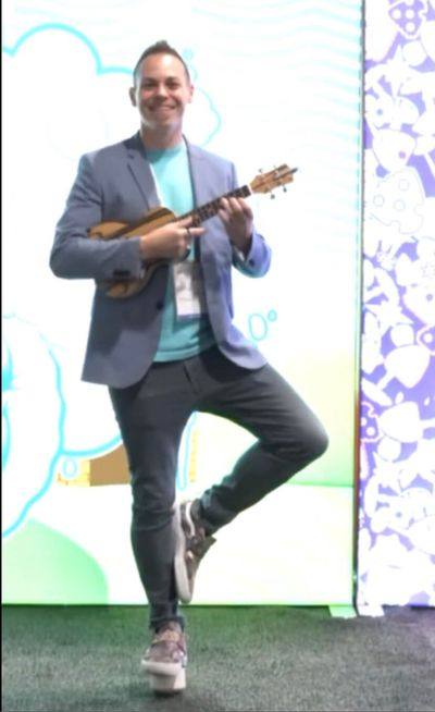 Ryan Today playing ukulele while balancing on one leg